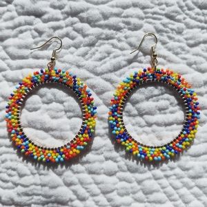 Handcrafted beaded hoops.